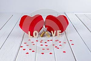 Valentines Day background with Red Heart shape and Couple Combination golden padlock on white wooden table
