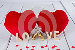 Valentines Day background with Red Heart shape and Couple Combination golden padlock on white wooden table