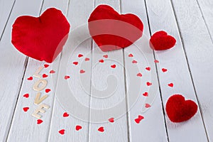 Valentines Day background with Red Heart shape on white wooden table