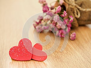 Valentines day background with red hearts on wood floor. Love and Valentine concept