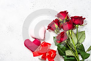 Valentines day background. Red roses, hearts and present on white.