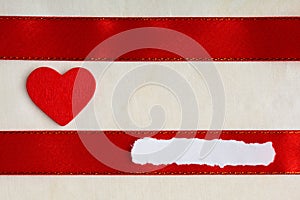 Valentines day background. Red satin ribbon and heart.