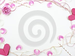 Valentines Day background. Rose, rose petals, heart, paper, straws and rope, beautiful Isolated on pastel pink backgrounds. Valent