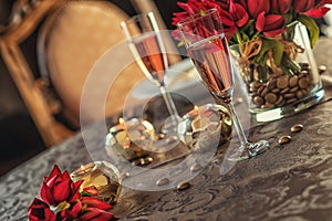 Valentines day background with roses, candles and champagne in hotel or restaurant, romantic evening