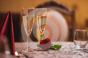 Valentines day background with roses and champagne in hotel or restaurant, romantic evening