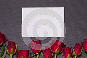 Valentines day background,seamless black background,red roses,white epmty card, free copy text space