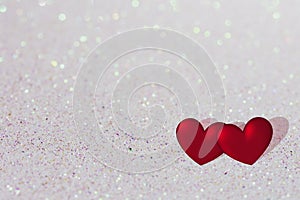 Valentines day background, two red hearts on shiny bright background with copy space, valentine card