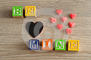 Valentines Day. Be Mine Spelled with colorful alphabet blocks