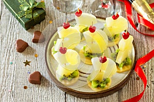 Valentines day or birthday romantic antipasto. Canapes with cheese and pineapple