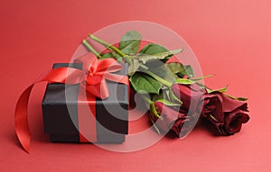 Valentines Day black box with red ribbon gift and red rose
