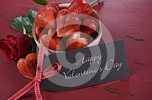 Valentines Day bowl of luscious heart shape red strawberries