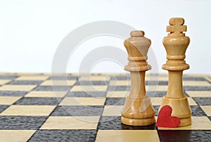 Valentines Day card: Heart, king and queen on the chess board