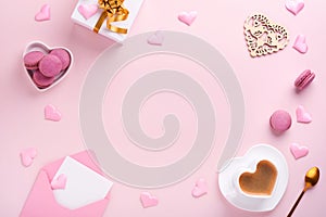 Valentines Day card. Pink empty envelope, macaron macaroon cookie and heart shaped coffee cup on pink background. 8 March, Womens