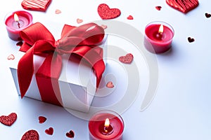 Valentines day card: red love hearts, romantic gift box, candle on white background. February romance present card