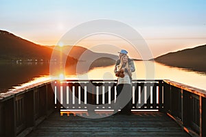 Valentines Day celebration: Romantic couple in love man and woman hugging on pier enjoying sunset view