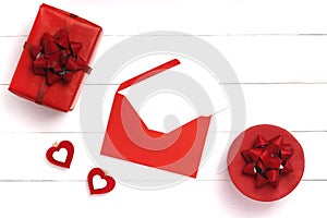 Valentines Day composition. Heart, gift on white wooden surface. Valentine`s day concept. Flat lay, top view, from above