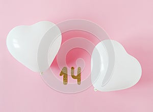 Valentines day composition. Pink background with white heart shape baloons. February 14 greeting concept. Top view