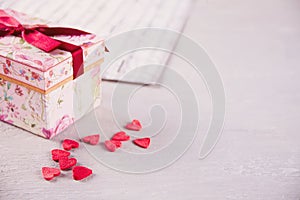 Valentines day concept with candy sweet hearts and gift box