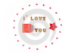 Valentines day concept. Declaration of love, frame made of paper hearts, lollipop. In the center red gift box with engagement ring
