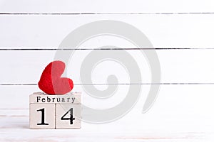 Valentines day concept. February 14 text on wooden block