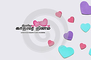 Valentines day concept. Multicolor hearts on white background and Happy Valentines day translate Tamil text. copy space