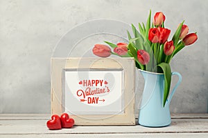 Valentines day concept with tulip flowers and photo frame