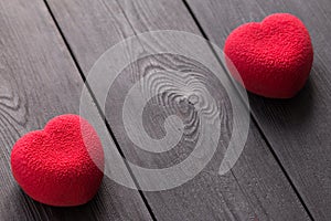 Valentines day concept. Two Red heart velvet cakes on a wooden black surface