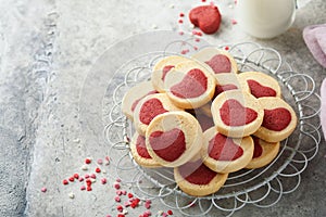 Valentines day cookies. Shortbread cookies inside a sweet red heart on pink plate on grey background. Mothers day. Womans day. Swe