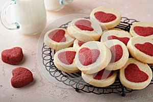 Valentines day cookies. Shortbread cookies inside a sweet red heart on pink plate on pink background. Mothers day. Womans day. Swe