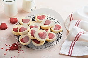 Valentines day cookies. Shortbread cookies inside a sweet red heart on pink plate on pink background. Mothers day. Womans day. Swe