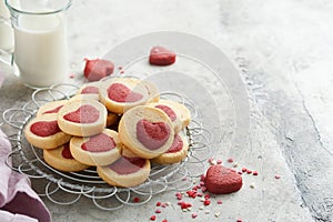 Valentines day cookies. Shortbread cookies inside a sweet red heart on pink plate on grey background. Mothers day. Womans day. Swe