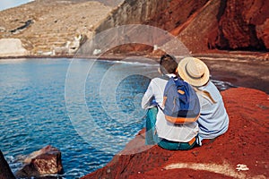 Valentines day. Couple in love enjoying honeymoon on Red beach in Santorini island, Greece. Vacation and traveling