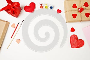 Valentines day craft top view. Handmade valentine card  DIY present. red hearts decoration on whitebackground. copy space