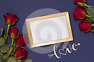 Valentines day,empty frame,love,blue background,flatlay,red roses,free copy text space, message