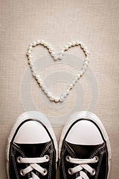 Valentines day flat lay banner. Chucks and pearls female concept.