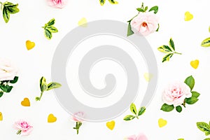 Valentines day frame composition with pink roses, leaves and golden confetti on white background. Flat lay, top view.