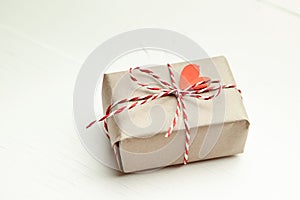 Valentines day gift box decorated with red heart on white background