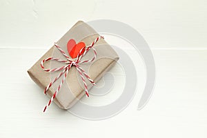 Valentines day gift box decorated with red heart on white background