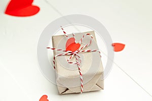 Valentines day gift box decorated with red hearts on white background