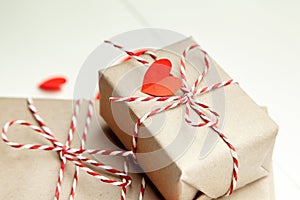 Valentines day gift box decorated with red hearts on white background