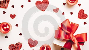 Valentines day gift box, red love hearts, romantic candle on white background. Romantic message template with copy space. Top View