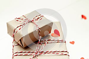 Valentines day gift box and red paper hearts on white background