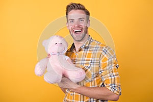 Valentines day gift. Man hug soft toy. Make surprise concept. Positive vibes. Cute teddy bear toy. Softness tenderness