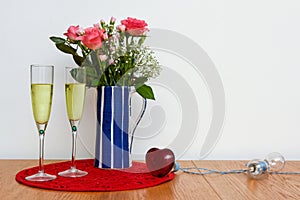 Valentines day gifts and flowers arranged on a table