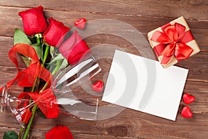 Valentines day greeting card, gift box and red roses