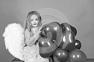 Valentines day. Happy angel girl over white. Cute child girl posing with angel wings. Angel child. Beautiful little
