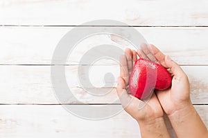 Valentines day, Health care, love, organ donation concept. Woman hands holding red heart