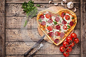 Valentines day heart shaped pizza with pepperoni