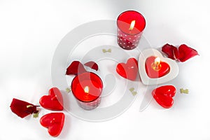 Valentines Day hearts, candles and rose petals on white backgro