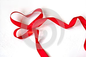 Valentines day holiday blank greeting card heart made of red satin ribbon on white background